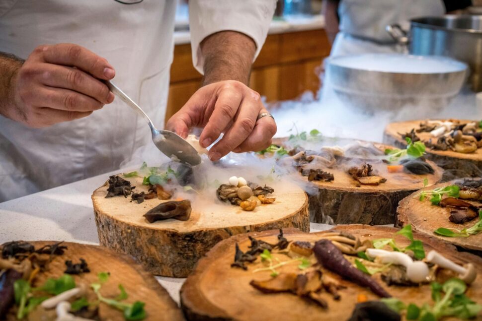 https://www.pexels.com/photo/chef-preparing-vegetable-dish-on-tree-slab-1267320/