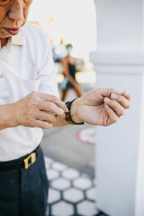 https://www.pexels.com/photo/man-in-white-dress-shirt-holding-fixing-his-watch-5637485/