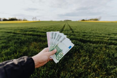 https://www.pexels.com/photo/crop-farmer-showing-money-in-green-summer-field-in-countryside-4497591/