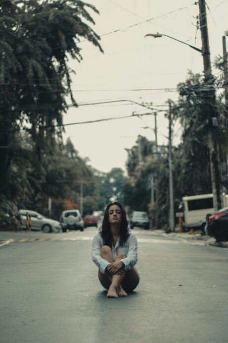 https://www.pexels.com/photo/woman-sitting-on-road-3125006/