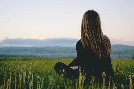 https://www.pexels.com/photo/woman-wearing-black-long-sleeved-shirt-sitting-on-green-grass-field-691919/