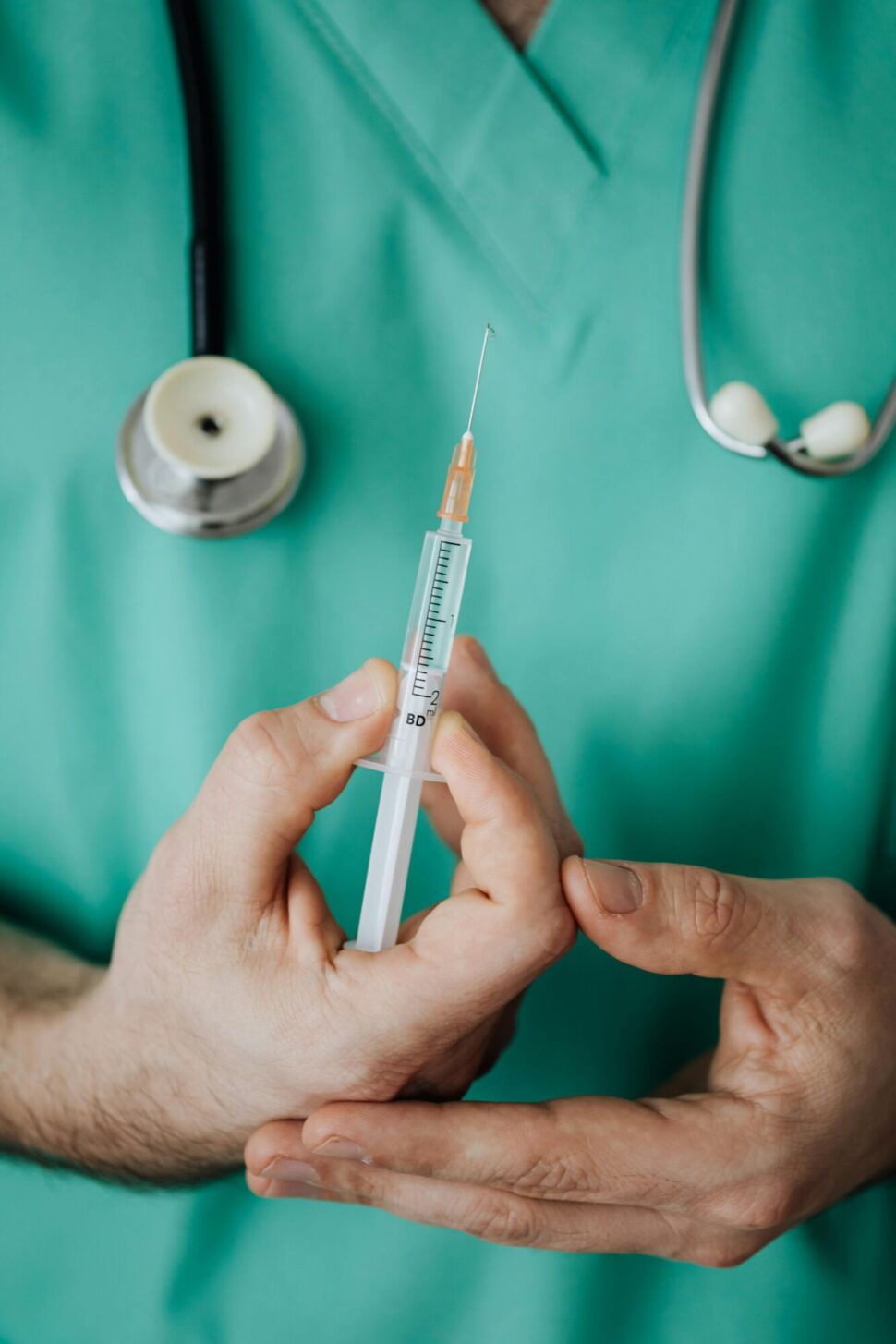 https://www.pexels.com/photo/person-holding-a-vaccine-4047186/