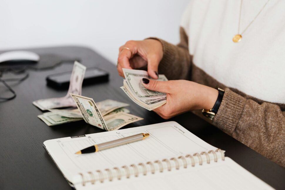 https://www.pexels.com/photo/person-counting-cash-money-4475523/