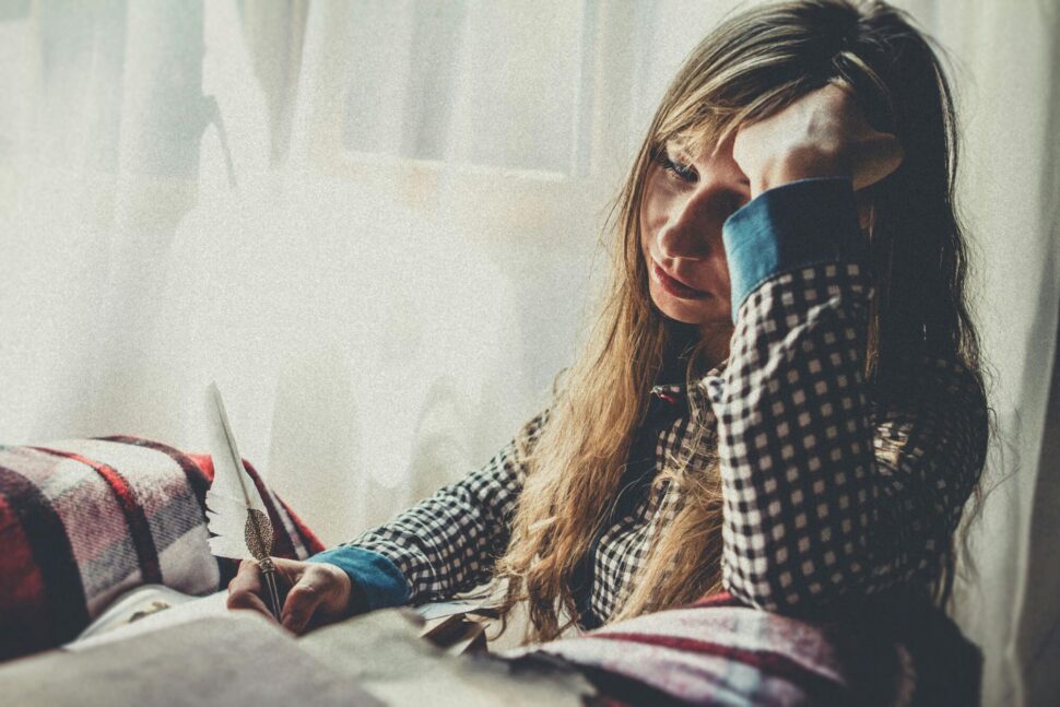 https://www.pexels.com/photo/woman-holding-feather-pen-1650209/