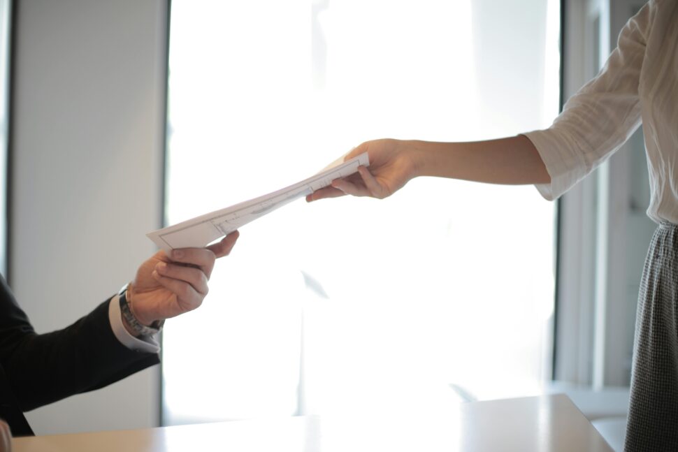 https://www.pexels.com/photo/job-applicant-passing-her-documents-3760072/