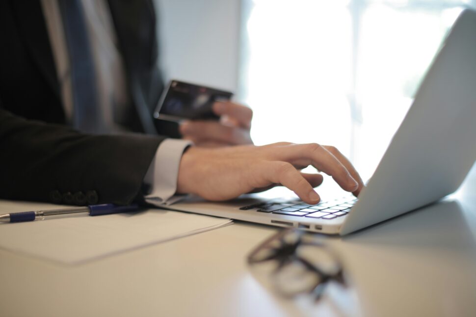 https://www.pexels.com/photo/person-in-black-suit-typing-on-a-computer-3760081/