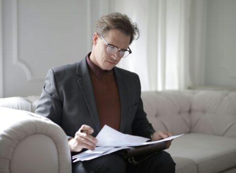 https://www.pexels.com/photo/classy-executive-male-reading-papers-on-couch-3760514/