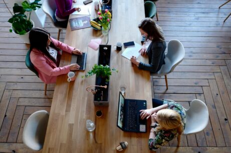 https://www.pexels.com/photo/three-woman-sitting-on-white-chair-in-front-of-table-2041627/