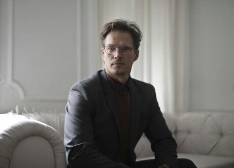 https://www.pexels.com/photo/well-dressed-businessman-sitting-on-sofa-3771839/