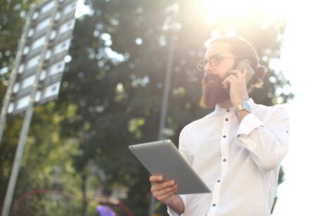 https://www.pexels.com/photo/man-in-white-long-sleeve-holding-a-silver-tablet-computer-3779990/
