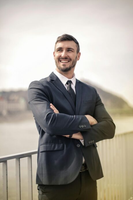https://www.pexels.com/photo/man-in-black-suit-jacket-standing-and-smiling-3777557/