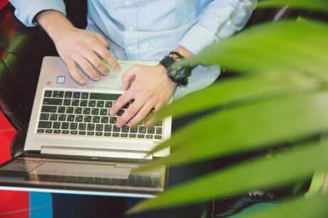 https://www.pexels.com/photo/person-in-white-shirt-using-laptop-3747100/
