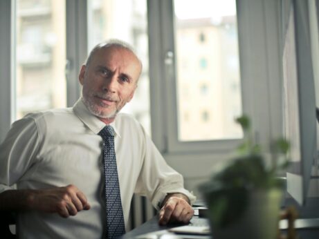 https://www.pexels.com/photo/man-sitting-on-chair-beside-table-834863/