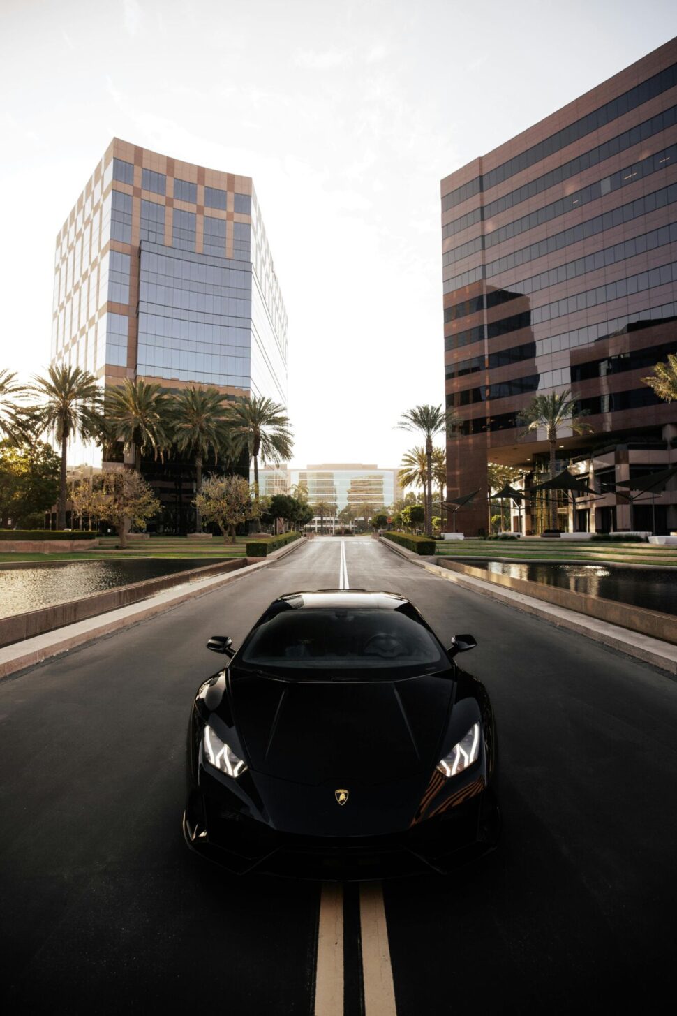 https://www.pexels.com/photo/a-black-sports-car-on-the-street-10394784/