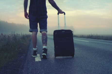 https://www.pexels.com/photo/man-walking-on-the-road-holding-black-luggage-during-sunset-160483/