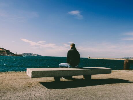 https://www.pexels.com/photo/person-wearing-blue-jeans-sitting-on-bench-1074535/