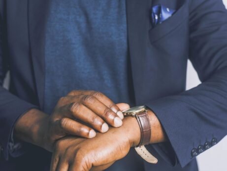 https://www.pexels.com/photo/standing-man-looking-his-watch-2813515/