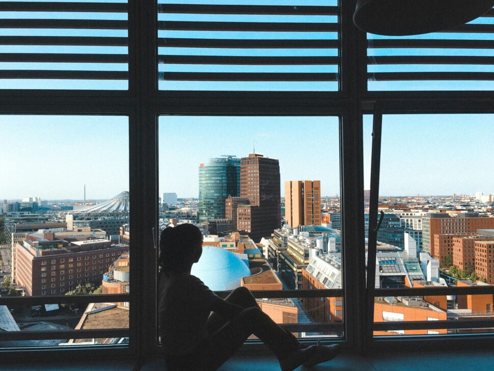 https://www.pexels.com/photo/photo-of-a-woman-looking-through-glass-wall-2516400/