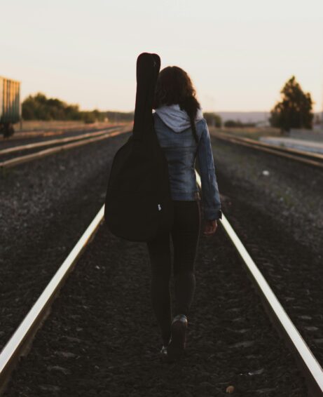 https://www.pexels.com/photo/woman-walking-on-road-1277110/