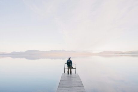 https://www.pexels.com/photo/man-wearing-jacket-standing-on-wooden-docks-leading-to-body-of-water-571169/