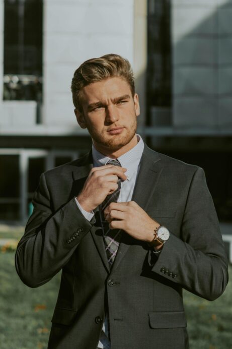 https://www.pexels.com/photo/elegant-young-bearded-businessman-in-suit-and-tie-in-downtown-4195342/