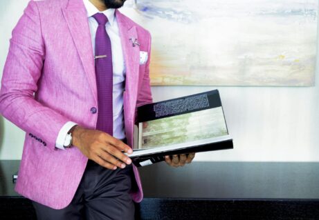 https://www.pexels.com/photo/man-in-pink-suit-jacket-holding-book-2247181/