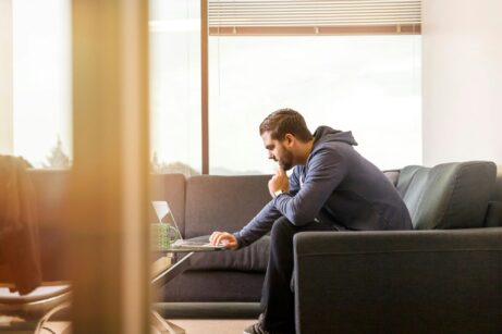https://www.pexels.com/photo/man-using-laptop-sitting-on-couch-1251852/