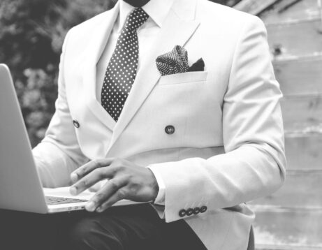 https://www.pexels.com/photo/grayscale-photo-of-man-wearing-white-suit-jacket-936089/
