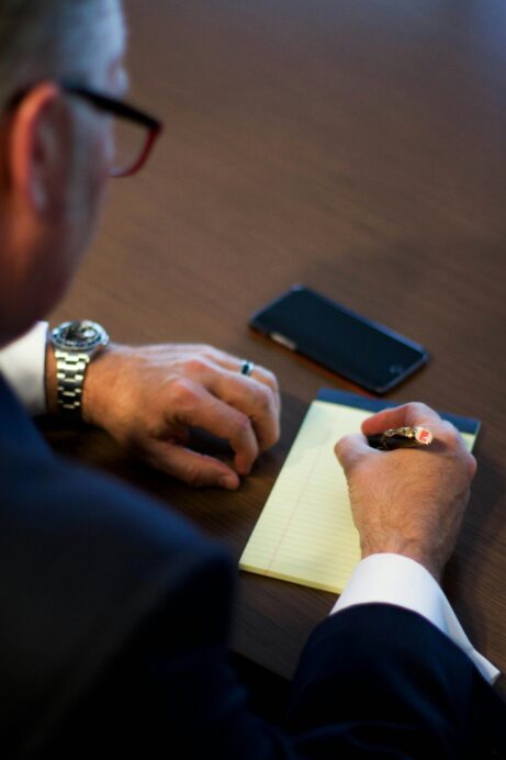 https://www.pexels.com/photo/person-writing-notes-on-white-ruled-paper-164666/