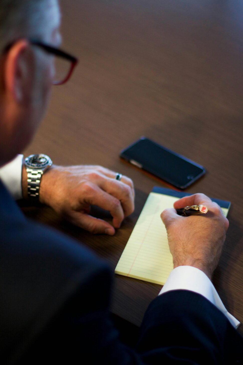 https://www.pexels.com/photo/person-writing-notes-on-white-ruled-paper-164666/