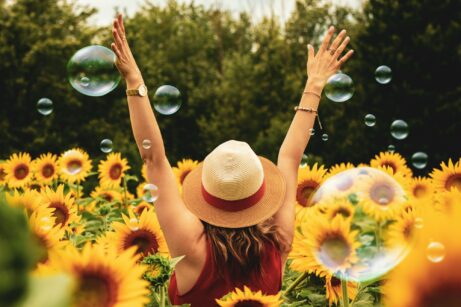 https://www.pexels.com/photo/woman-surrounded-by-sunflowers-1263986/
