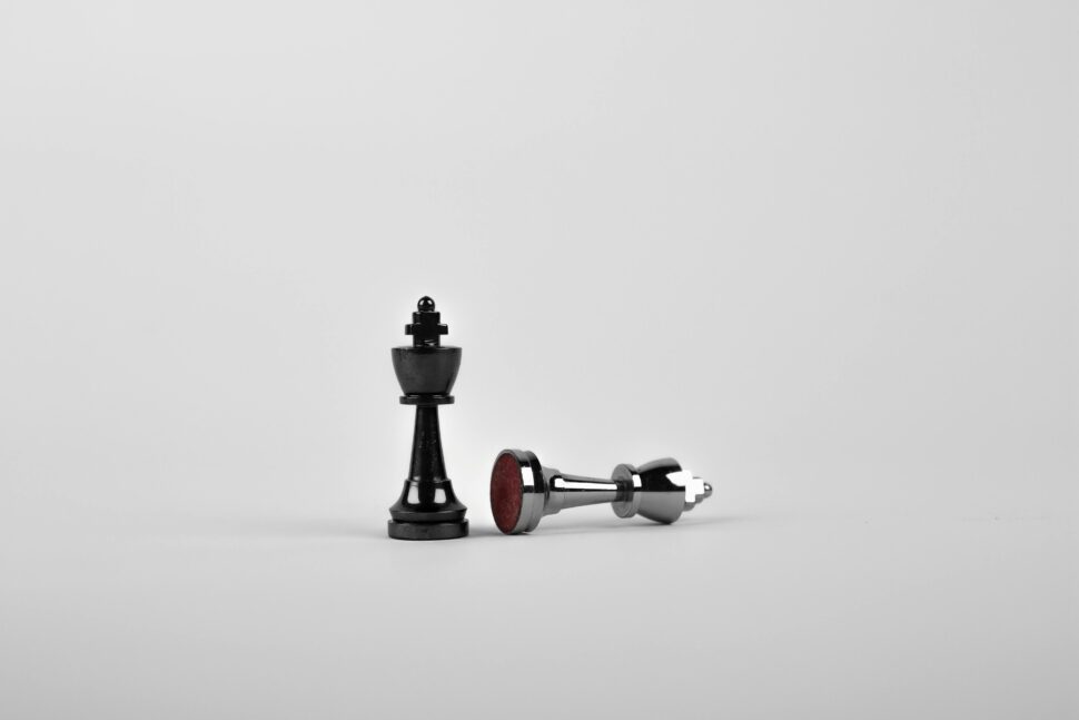 https://www.pexels.com/photo/two-silver-chess-pieces-on-white-surface-411207/