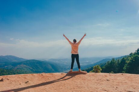 https://www.pexels.com/photo/woman-standing-on-cliff-1134190/