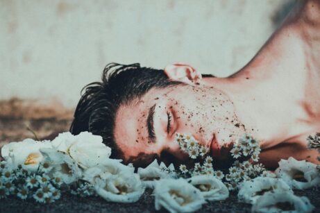 https://www.pexels.com/photo/man-lying-on-white-flowers-3554374/