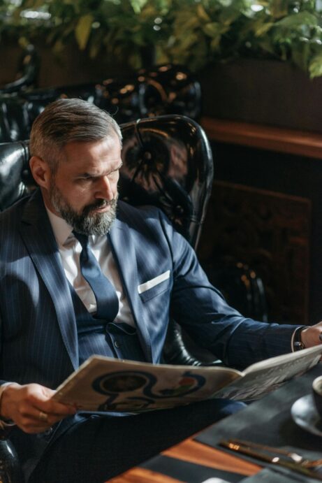 https://www.pexels.com/photo/a-man-reading-the-newspaper-7519009/