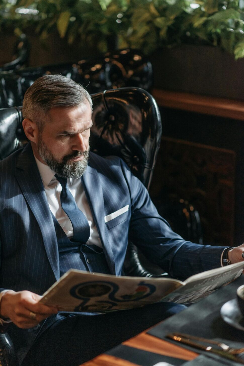 https://www.pexels.com/photo/a-man-reading-the-newspaper-7519009/