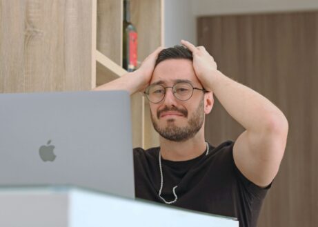 https://unsplash.com/photos/a-man-with-glasses-is-looking-at-a-laptop-hHg9MC-G8_Y