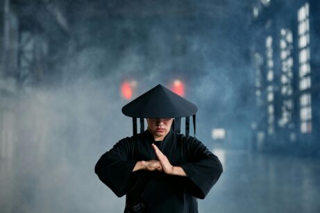 https://www.pexels.com/photo/a-man-wearing-a-black-outfit-and-a-conical-hat-7777429/