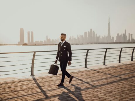https://www.pexels.com/photo/man-walking-on-pavement-while-holding-a-bag-3307862/