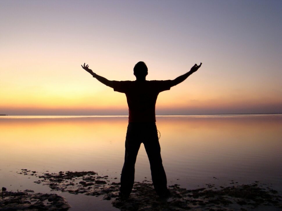 https://www.pexels.com/photo/silhouette-of-man-standing-beside-ocean-during-sunset-103889/