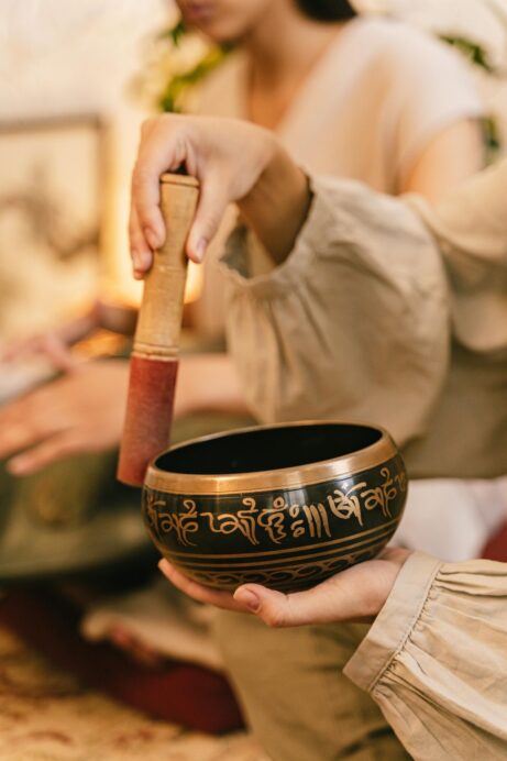 https://www.pexels.com/photo/person-holding-a-tibetan-singing-bowl-7970243/