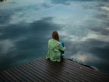 https://www.pexels.com/photo/woman-sitting-on-wooden-planks-2865901/